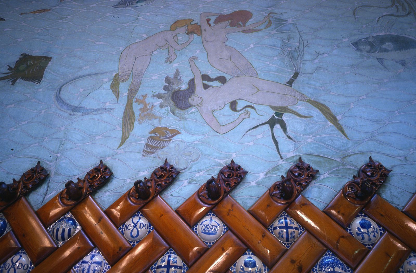 How do mermaids and sharks compare in mythological contexts?